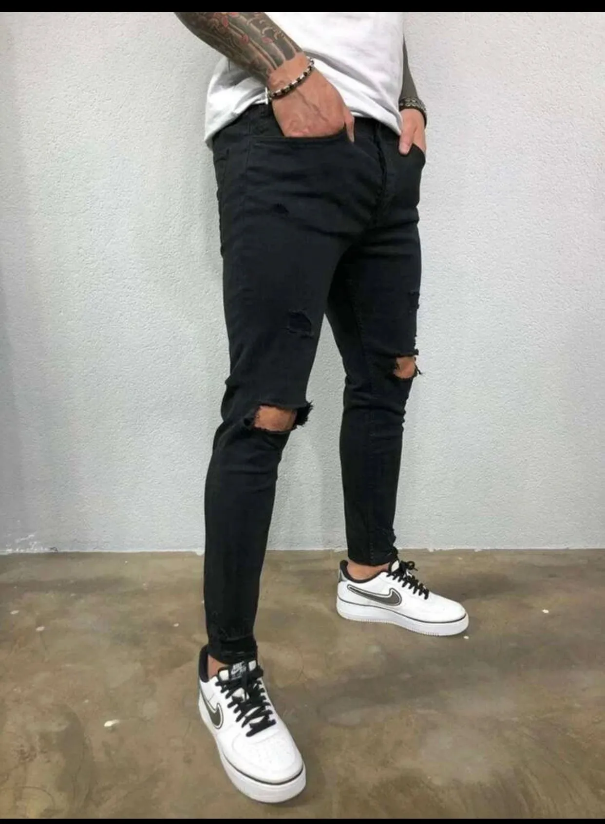 Men’s black ripped detail skinny jeans