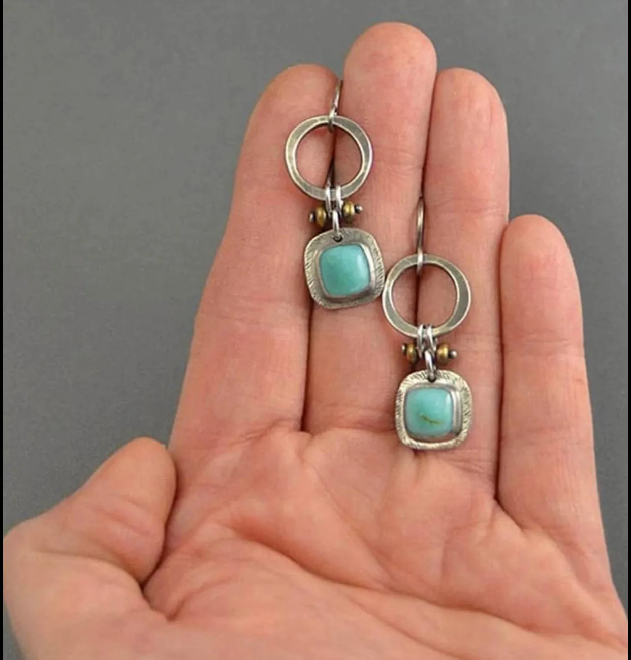 Round decor turquoise drop earrings.