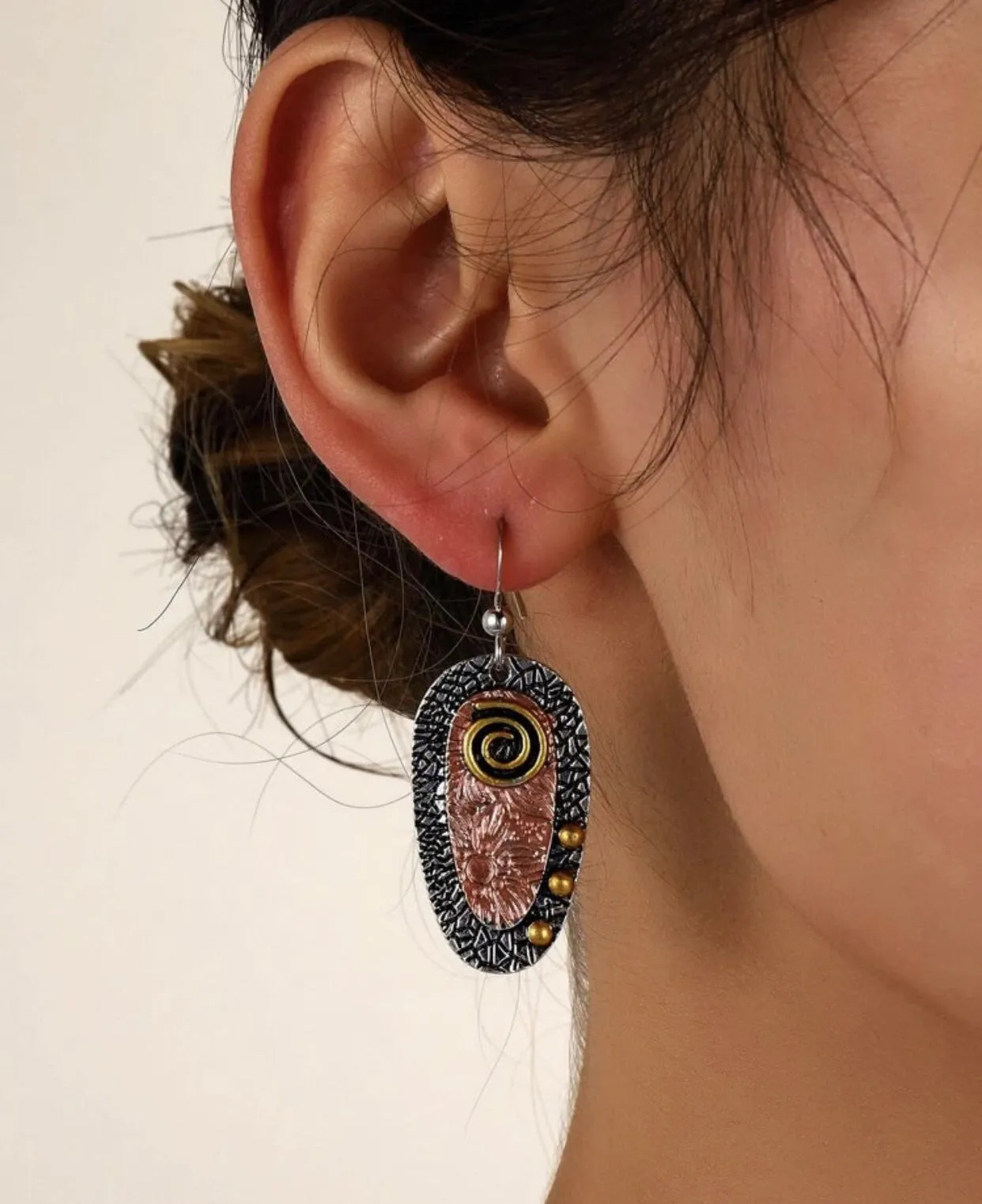 Textured metal three tone dangle earrings